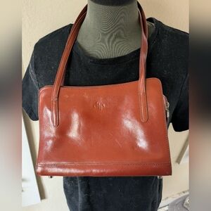 Monsac shoulder small bag 10" W X 7 2/2". 1 outside open pocket and one zippered